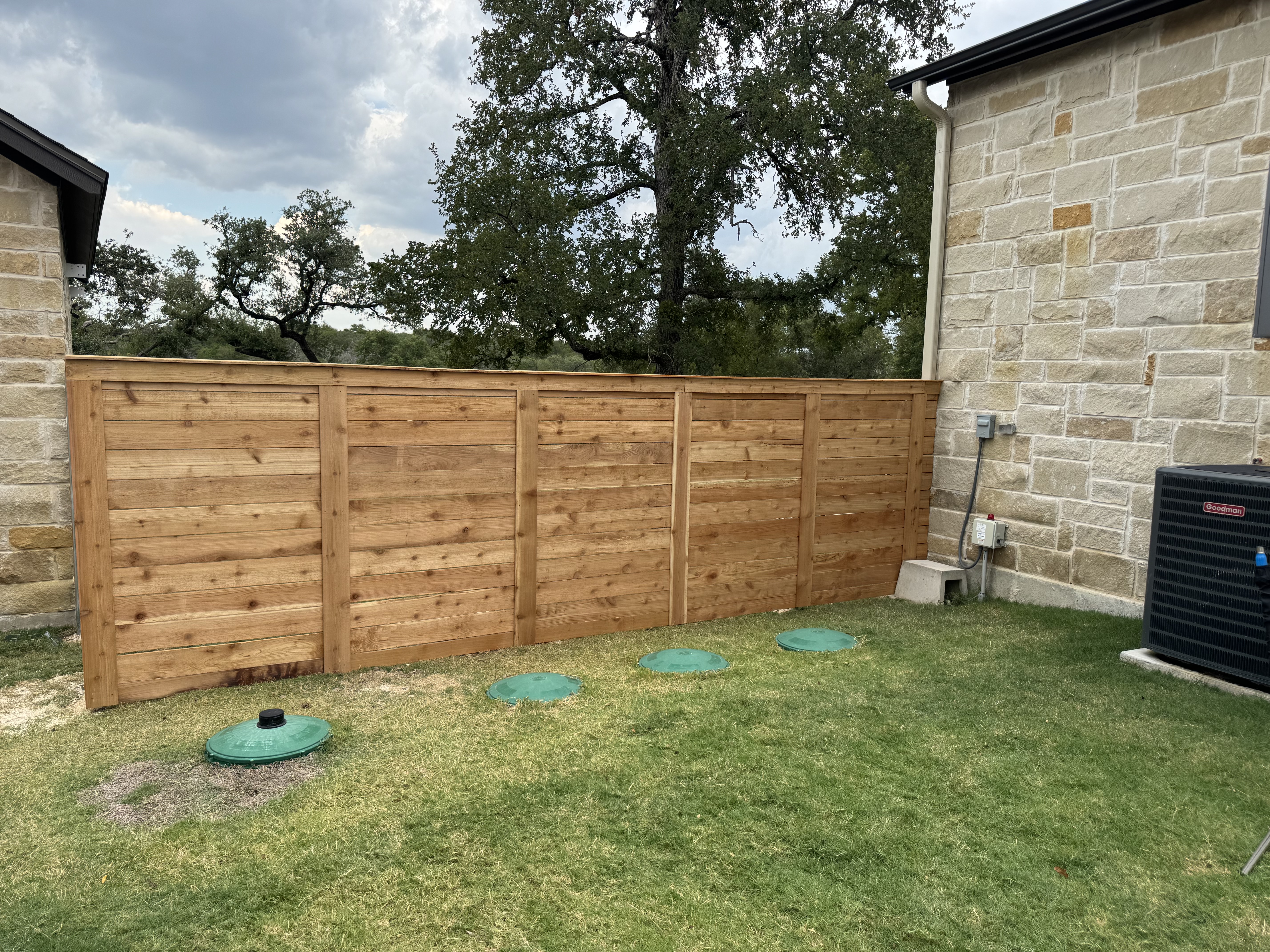 Custom horizontal cedar fence installation in Waco, Texas