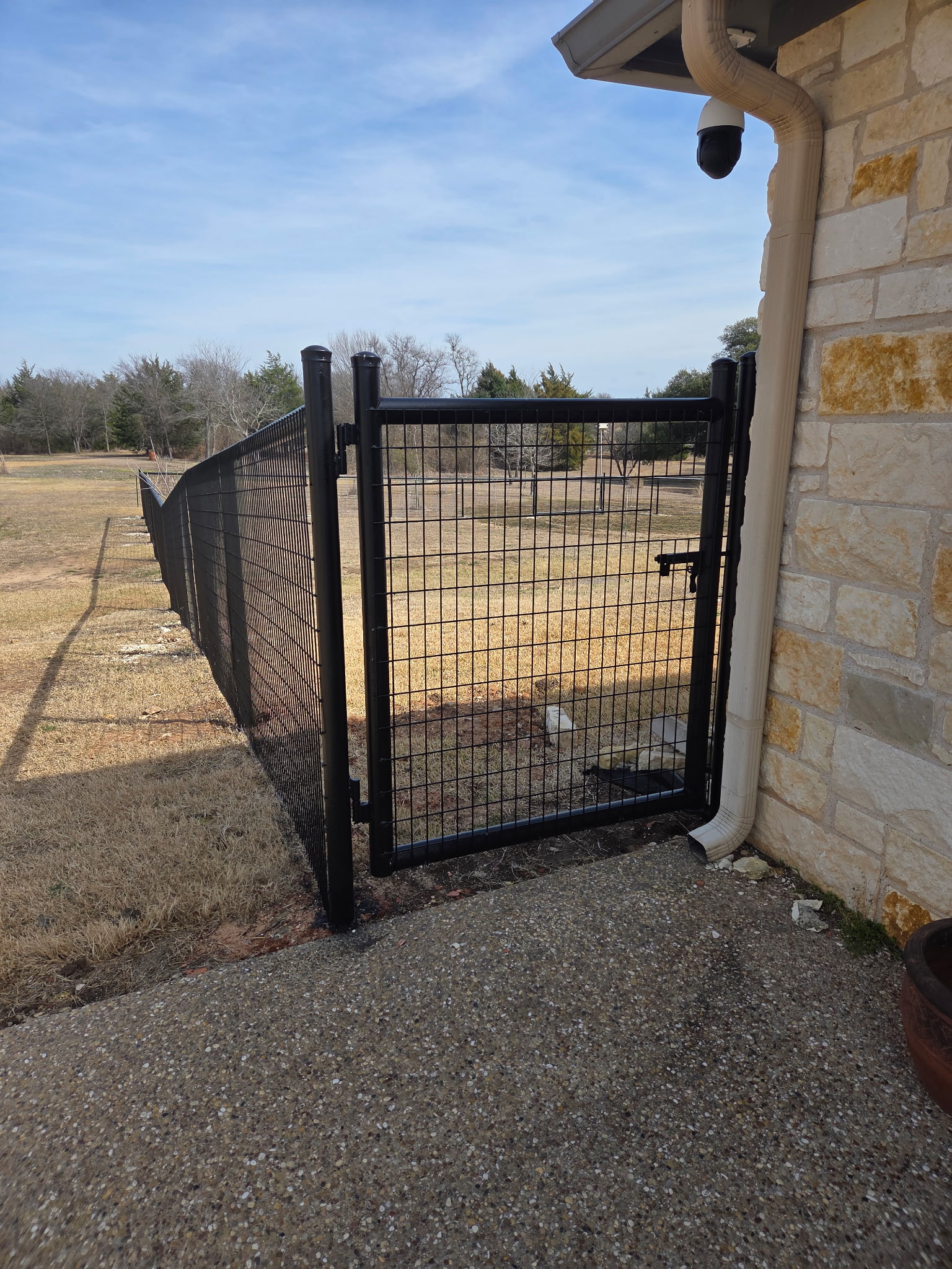 Metal gate at stone house